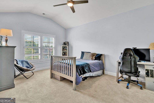 bedroom with vaulted ceiling, carpet, an office area, baseboards, and a ceiling fan
