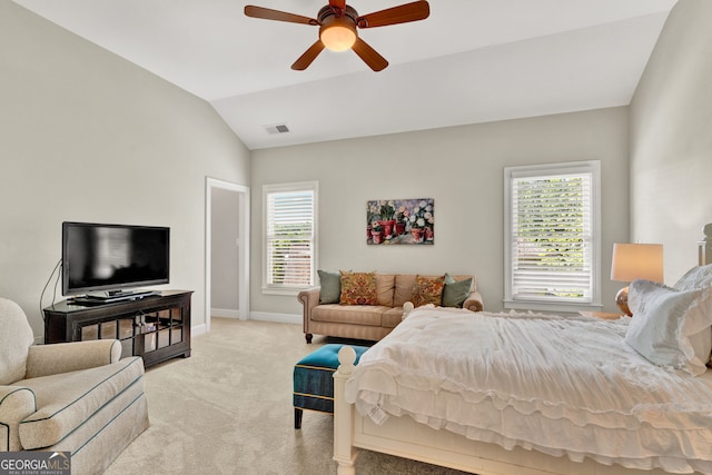 bedroom featuring multiple windows, carpet, lofted ceiling, baseboards, and a ceiling fan