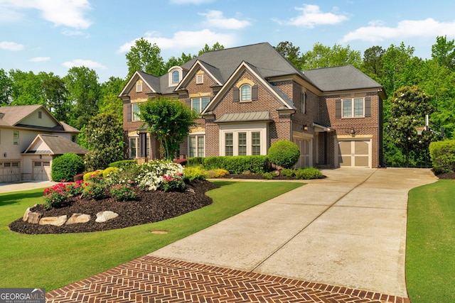 view of front of property featuring driveway, brick siding, and a front lawn