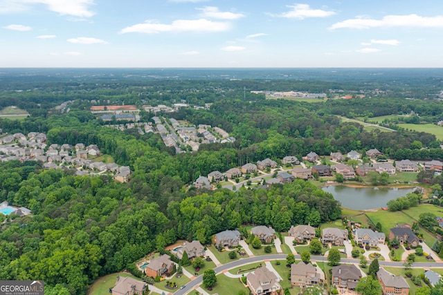 aerial overview of property's location featuring nearby suburban area and a large body of water