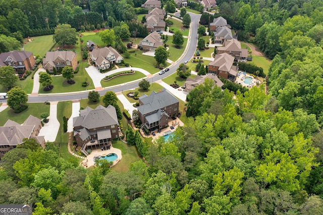 aerial view of residential area with a pool area