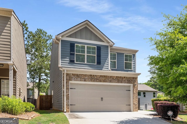 3406 Pennington Dr, Lithonia, GA 30038 - view of front of home with an attached garage, board and batten siding, concrete driveway, fence, and brick siding