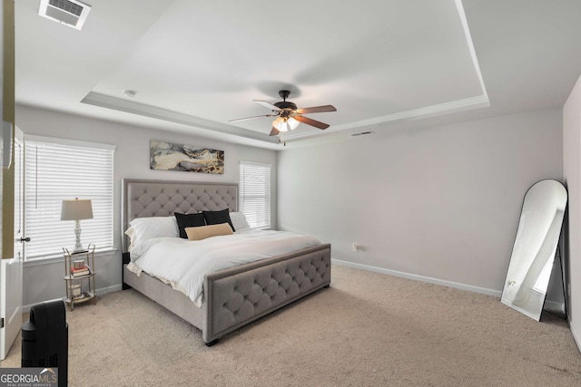 3406 Pennington Dr, Lithonia, GA 30038 - bedroom featuring a tray ceiling, baseboards, and carpet floors