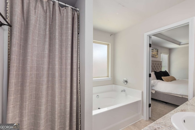3406 Pennington Dr, Lithonia, GA 30038 - full bathroom featuring ensuite bath, a garden tub, and a sink