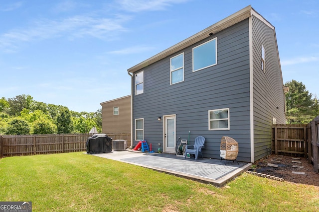 3406 Pennington Dr, Lithonia, GA 30038 - rear view of house featuring central AC and a patio area