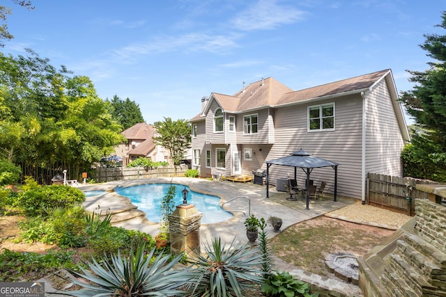 view of swimming pool with a gazebo, a patio, a fenced backyard, and central AC