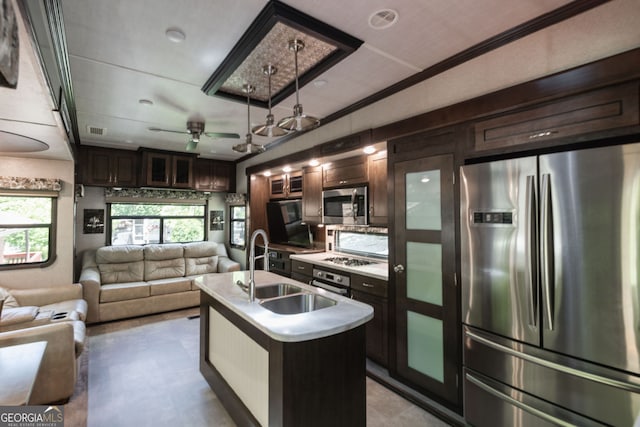 43 Tip Top Cir, Cleveland, GA 30528 - kitchen featuring stainless steel appliances, a sink, open floor plan, dark brown cabinets, and light countertops