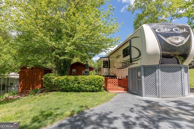 43 Tip Top Cir, Cleveland, GA 30528 - exterior space featuring a storage unit, an outdoor structure, and a yard