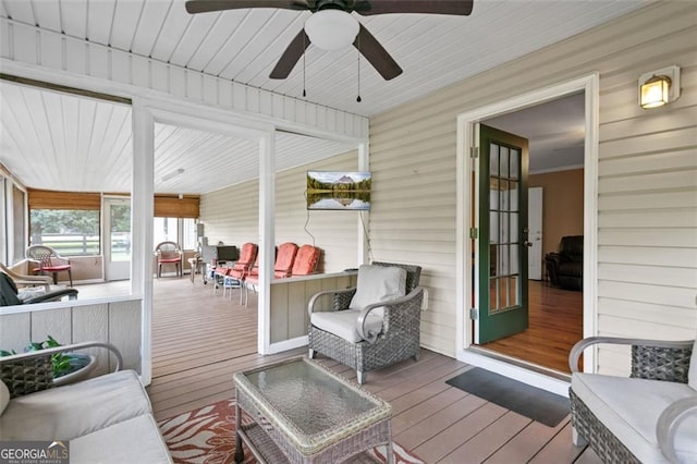 sunroom with a ceiling fan