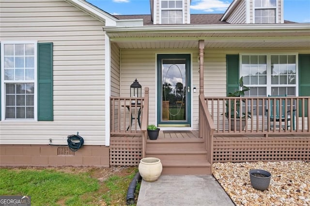 property entrance with covered porch