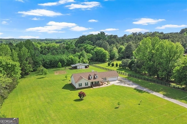 aerial view of sparsely populated area with a forest