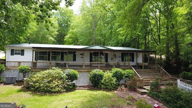 317 Cedar Dr NW, Sparta, GA 31087 - rear view of property with a porch, stairs, metal roof, a yard, and cooling unit