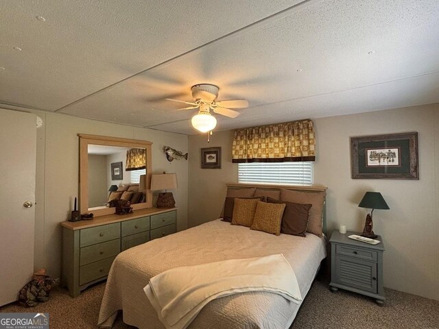 317 Cedar Dr NW, Sparta, GA 31087 - carpeted bedroom with a ceiling fan