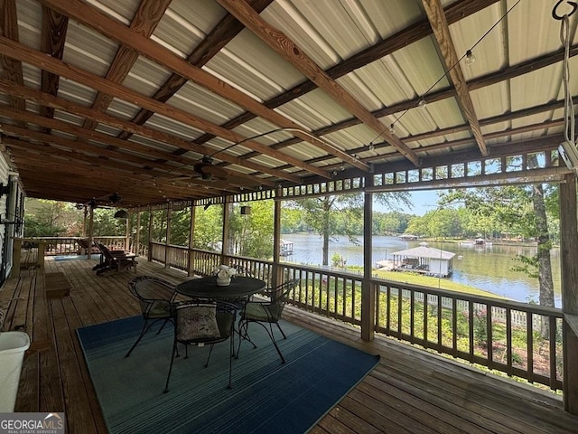 317 Cedar Dr NW, Sparta, GA 31087 - wooden terrace with a water view, outdoor dining space, and view of wooded area