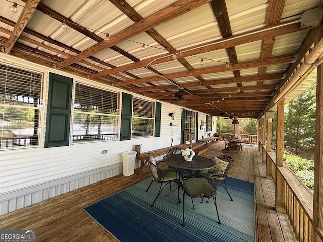 317 Cedar Dr NW, Sparta, GA 31087 - wooden terrace with outdoor dining area and ceiling fan