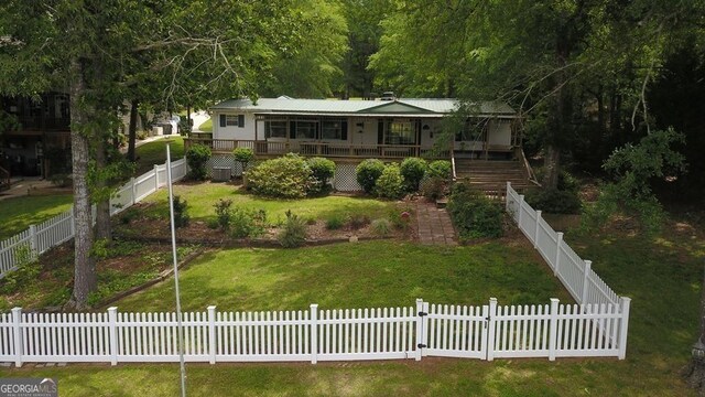 317 Cedar Dr NW, Sparta, GA 31087 - view of front of property with metal roof and stairs