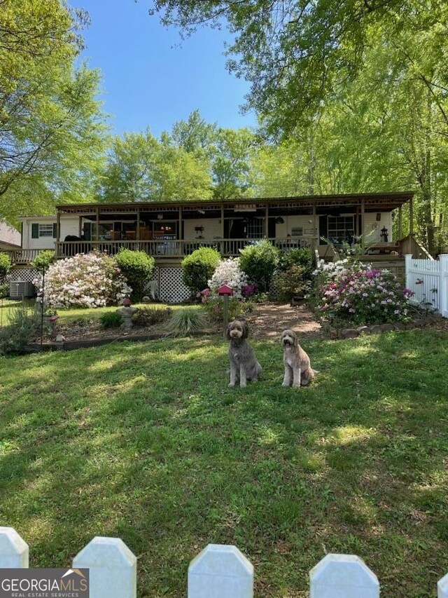 317 Cedar Dr NW, Sparta, GA 31087 - view of front facade featuring central AC
