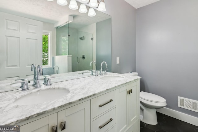 7675 Rose Ln, Cumming, GA 30040 - full bathroom featuring a shower stall, toilet, double vanity, baseboards, and tile patterned flooring