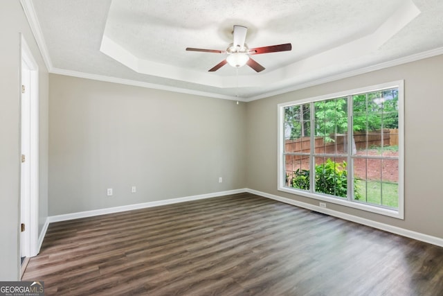 7675 Rose Ln, Cumming, GA 30040 - spare room featuring a raised ceiling, ceiling fan, dark wood-style flooring, baseboards, and a textured ceiling