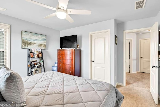 1903 Henderson Falls Way, Braselton, GA 30517 - bedroom with light colored carpet, baseboards, and a ceiling fan
