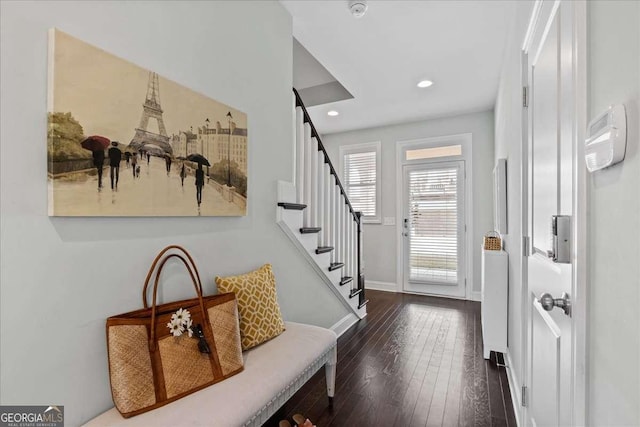 entrance foyer featuring dark wood finished floors, stairs, baseboards, and recessed lighting