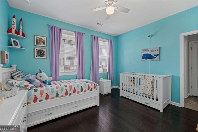 bedroom with wood finished floors, baseboards, and a ceiling fan