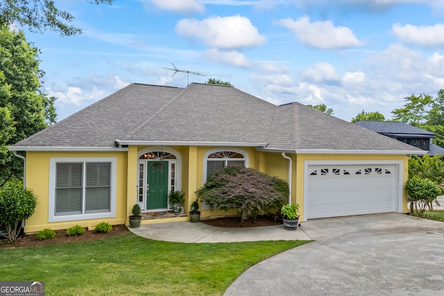 ranch-style home with a shingled roof, stucco siding, an attached garage, and concrete driveway
