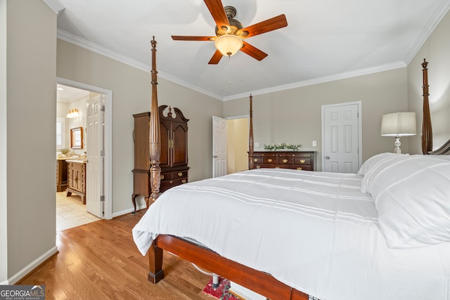 bedroom featuring crown molding, light wood-type flooring, baseboards, a ceiling fan, and ensuite bath