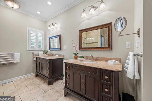 bathroom with ornamental molding, two vanities, tile patterned flooring, a tile shower, and recessed lighting