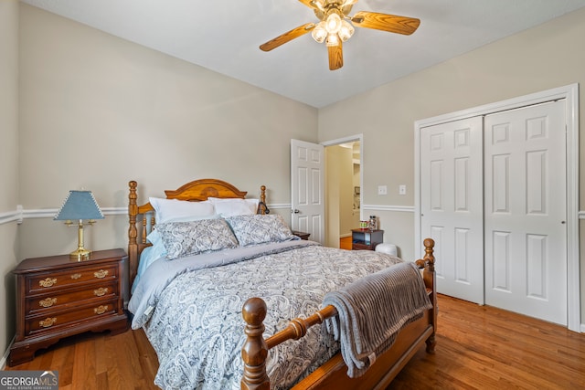 bedroom with wood finished floors, a closet, and ceiling fan