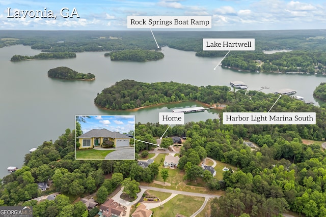 bird's eye view of a nearby body of water and a forest