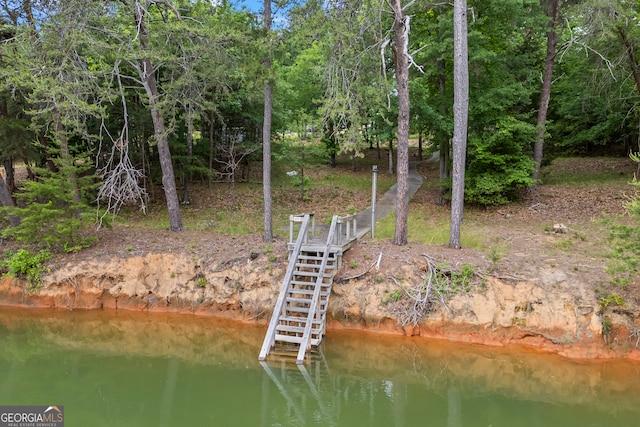dock featuring a water view and stairway