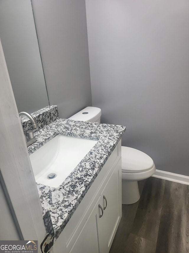 324 Cynthia Ct, Jonesboro, GA 30238 - bathroom featuring vanity, toilet, baseboards, and wood finished floors
