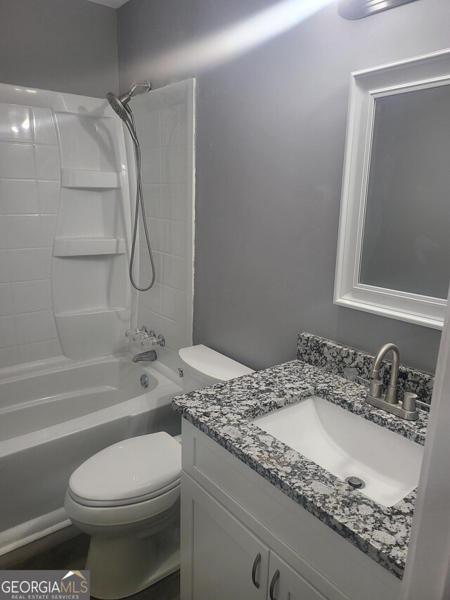 324 Cynthia Ct, Jonesboro, GA 30238 - bathroom featuring toilet, shower / washtub combination, and vanity