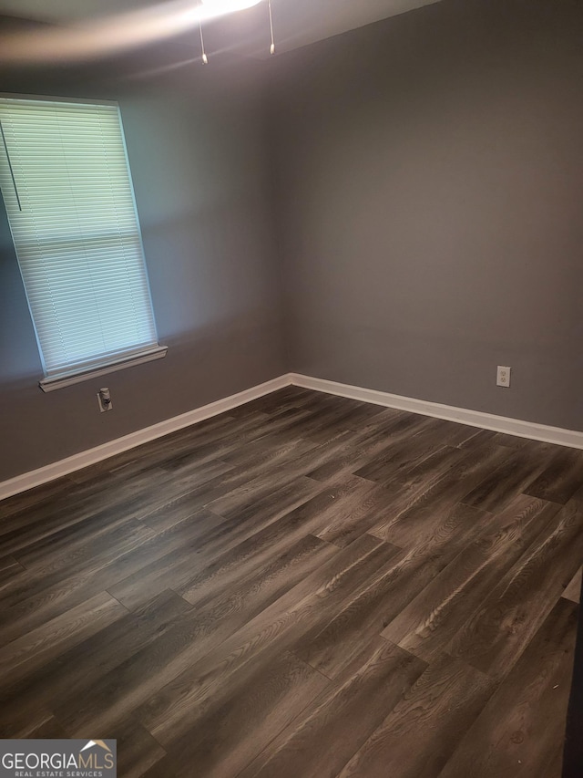 324 Cynthia Ct, Jonesboro, GA 30238 - spare room with dark wood-style flooring and baseboards