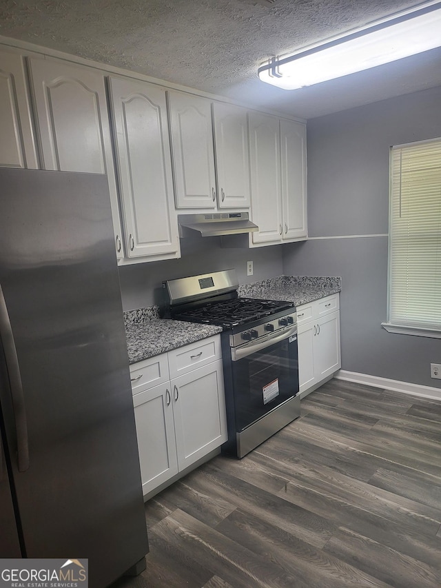 324 Cynthia Ct, Jonesboro, GA 30238 - kitchen featuring stainless steel appliances, under cabinet range hood, white cabinetry, dark wood-style flooring, and a textured ceiling
