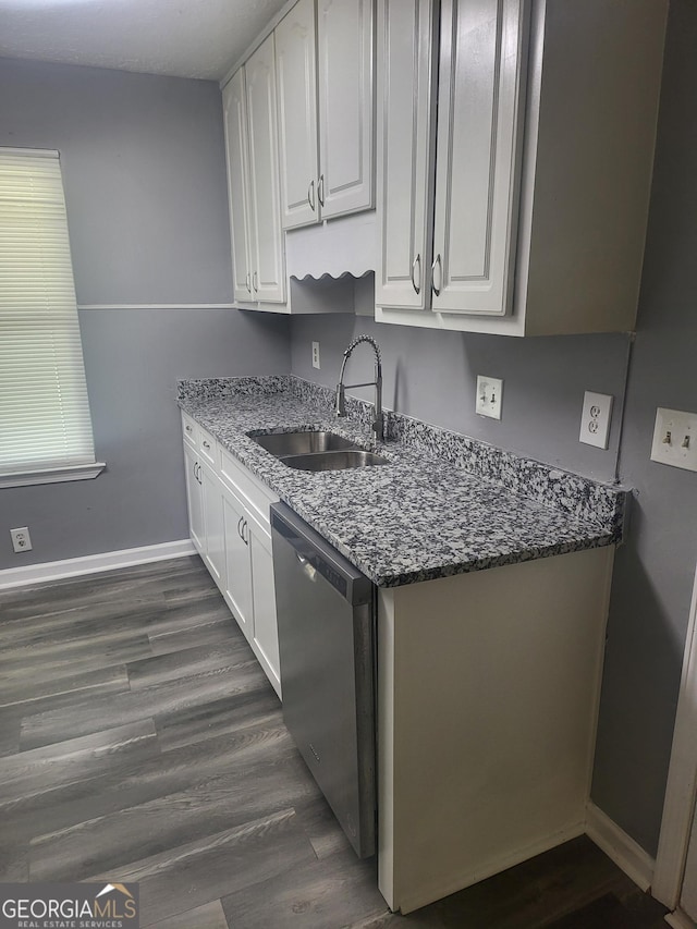 324 Cynthia Ct, Jonesboro, GA 30238 - kitchen featuring dishwasher, a sink, white cabinets, and baseboards