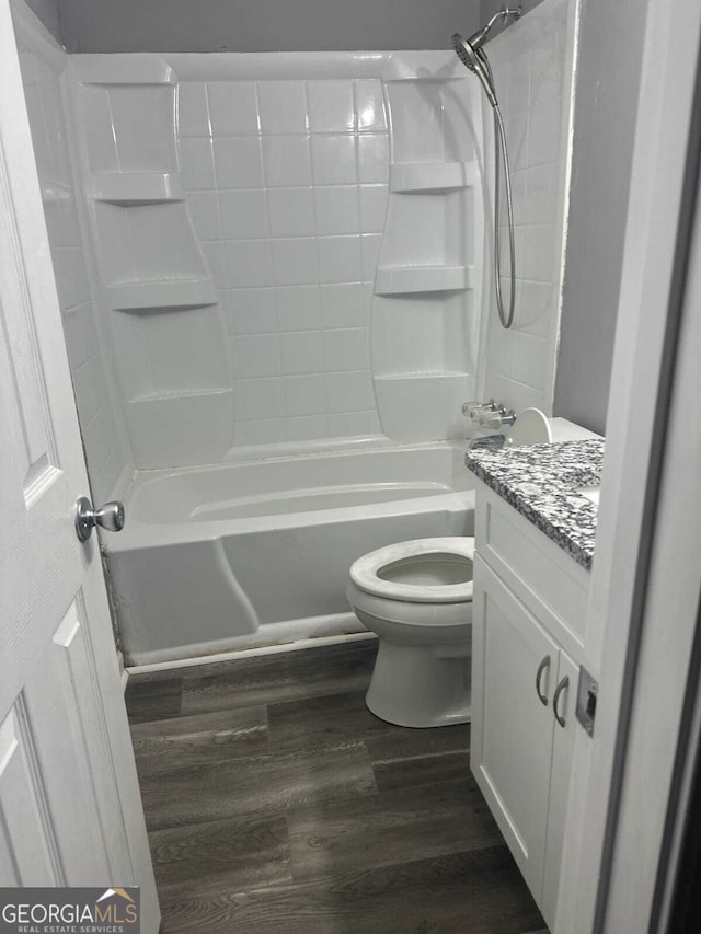 324 Cynthia Ct, Jonesboro, GA 30238 - bathroom with wood finished floors, toilet, bathtub / shower combination, and vanity