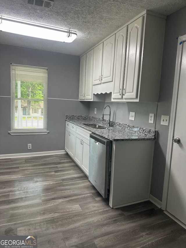 324 Cynthia Ct, Jonesboro, GA 30238 - kitchen featuring dishwasher, white cabinets, dark stone counters, baseboards, and a textured ceiling