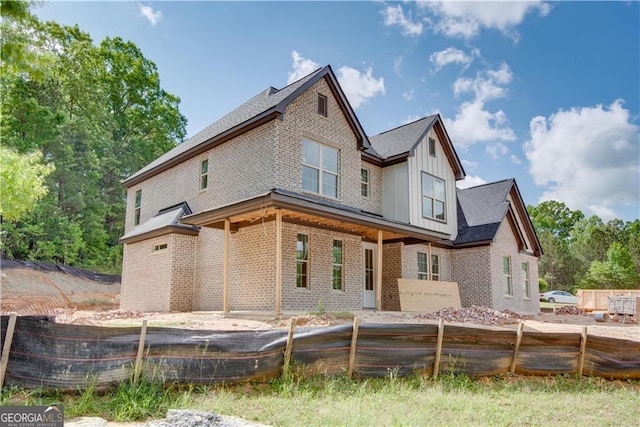 4222 Matisse Ln, Fairburn, GA 30213 - rear view of property featuring brick siding, fence, and board and batten siding