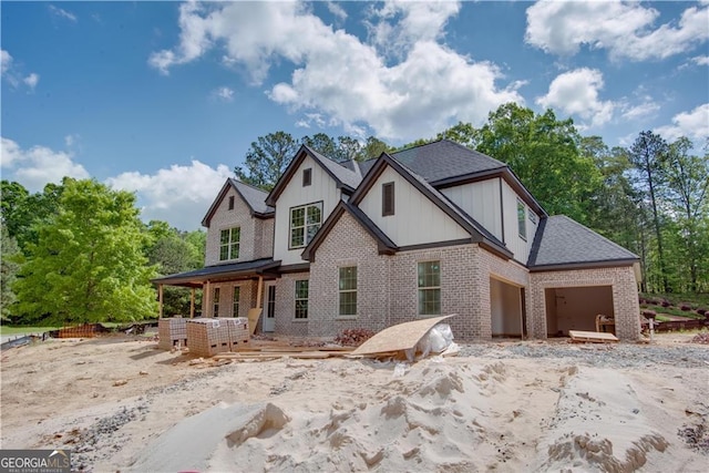 4222 Matisse Ln, Fairburn, GA 30213 - view of front of home featuring brick siding, board and batten siding, and a garage