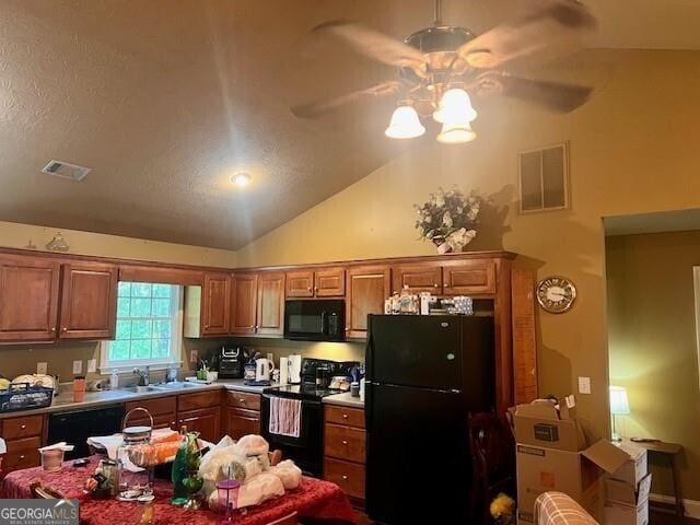 118 High Ridge Ln, Dahlonega, GA 30533 - kitchen featuring black appliances, ceiling fan, a sink, brown cabinetry, and vaulted ceiling