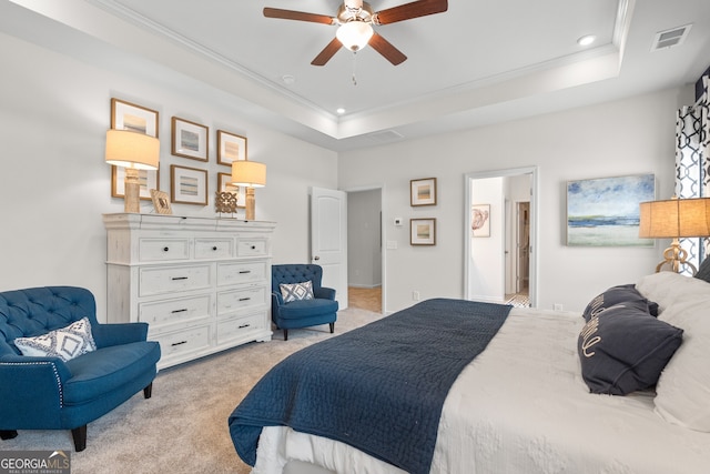 bedroom with light colored carpet, ornamental molding, recessed lighting, a raised ceiling, and ceiling fan