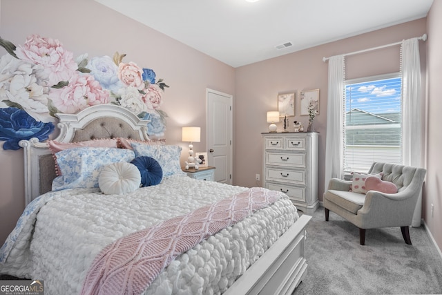 carpeted bedroom featuring baseboards