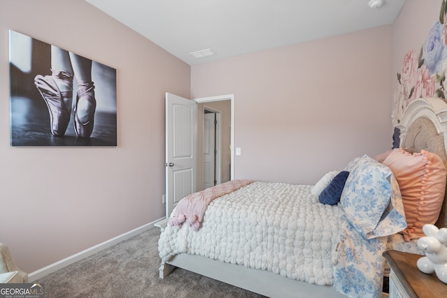 bedroom featuring carpet floors and baseboards