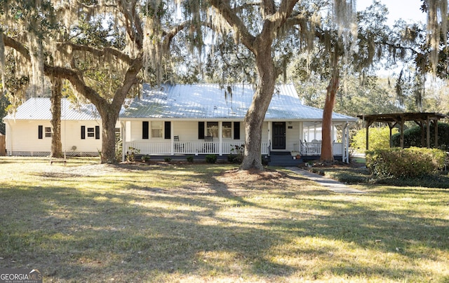 309 Mahan St, Saint Marys, GA 31558 - back of house featuring covered porch, a yard, and metal roof