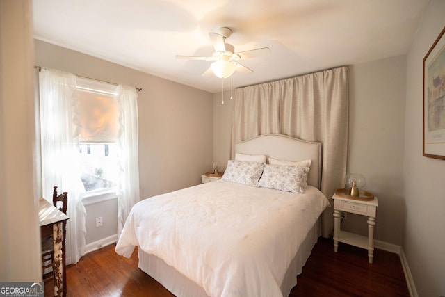 309 Mahan St, Saint Marys, GA 31558 - bedroom with dark wood finished floors, baseboards, and ceiling fan