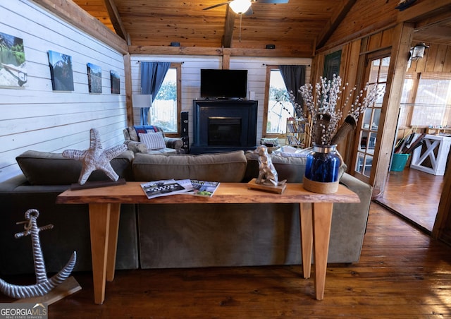 309 Mahan St, Saint Marys, GA 31558 - living room with wooden walls, wooden ceiling, hardwood / wood-style floors, and a glass covered fireplace