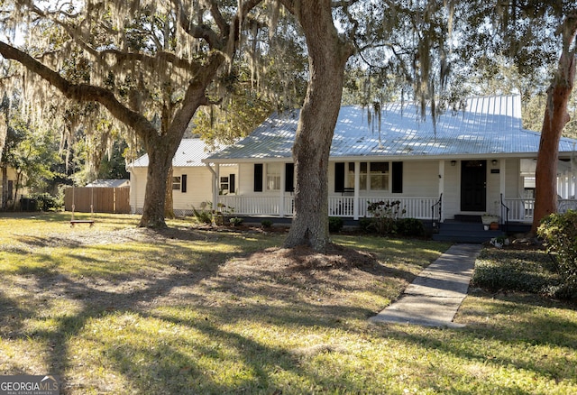 309 Mahan St, Saint Marys, GA 31558 - ranch-style home with a porch and metal roof