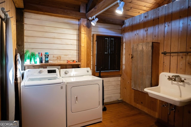309 Mahan St, Saint Marys, GA 31558 - washroom with separate washer and dryer, wood walls, wood finished floors, wooden ceiling, and a sink